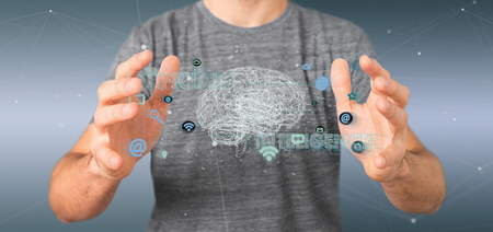 View of a Man holding a 3d rendering artificial intelligence concept with a brain and appの写真素材