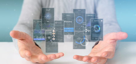 View of Businessman holding User interface screens with icon, stats and data 3d renderingの写真素材