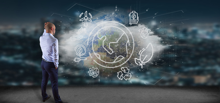 View of a Businessman in front of a World globe surronding by ecology icons and connection 3d renderingの写真素材