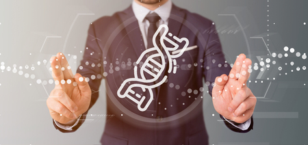View of a Businessman holding 
a DNA iconの写真素材