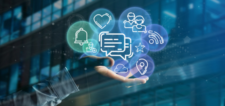 View of a Businessman holding a cloud of social media network icon