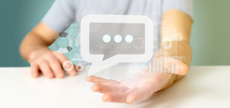 View of a Businessman holding a message icon with data in background - 3d renderingの写真素材