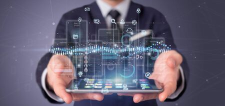 View of Businessman holding User interface screens with icon, stats and data 3d rendering