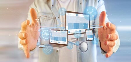 View of a Businessman holding Devices with medical icon and stethoscope 3d rendering