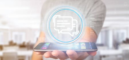 View of a Businessman holding a message iconの写真素材