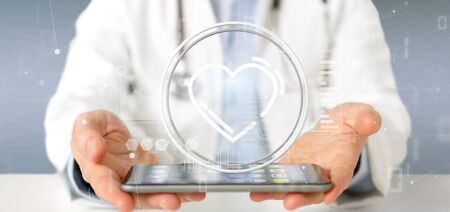 View of a Doctor holding a heart icon surrounded by dataの写真素材