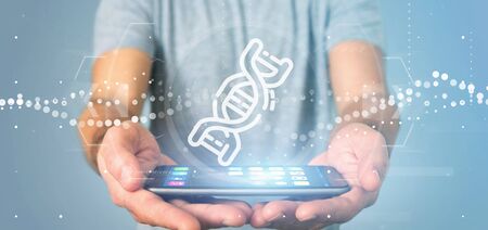 View of a Businessman holding 
a DNA iconの写真素材