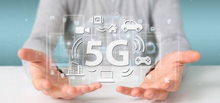 View of a Businessman holding a 5G connection with data surrounding - 3d renderingの写真素材