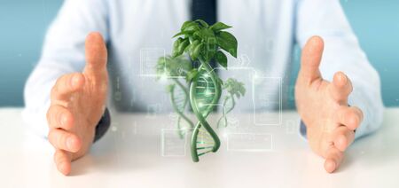 View of a Businessman holding a DNA growing as a plant - 3d rendering