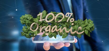 View of a Businessman holding a Wooden logo 100 % organic with leaves around 3d renderingの写真素材