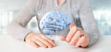View of a Businessman holding a Intelligence artificial brain with data - 3d renderingの写真素材