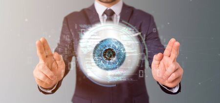 View of a Businessman holding a visual recognition eye concept with data - 3d renderingの写真素材