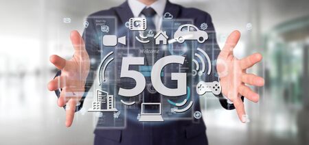 View of a Businessman holding a 5G connection with data surrounding - 3d renderingの写真素材