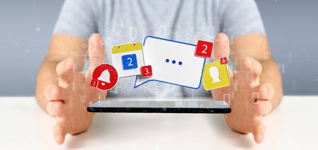 View of a Businessman holding Social network notifications - 3d renderingの写真素材