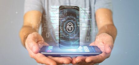 View of a Businessman holding Security data and smartphone security - 3d renderingの写真素材