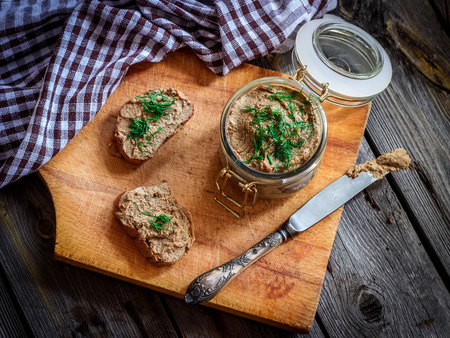 paste from a chicken liver, toasts on a wooden table. style rustic. selective focusの写真素材