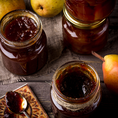 Pear jam on a wooden table. Style rustic. Selective focus.の写真素材