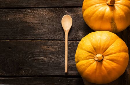 Pumpkins on dark wooden table. Style rustic. Selective focus.の写真素材