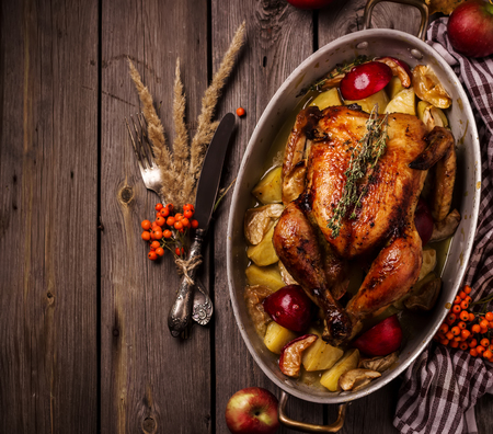 Served roasted stuffed Thanksgiving Turkey and vegetables from above and blank space. Fall decoration.Style rustic.の写真素材