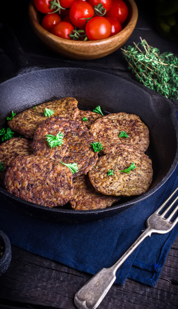 Fritters from a liver on dark wooden background. Style rustic. の写真素材