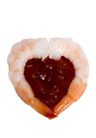 For all those who love shrimp.... two shrimp in the shape of a heart with cocktail sauce in between.の写真素材