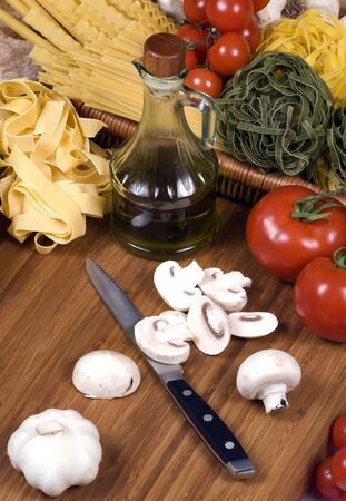 All the fixings for great Italian pasta. Lots of fresh vegetables and spices straight from the garden.の写真素材