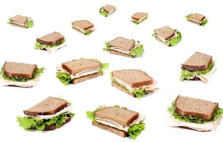 A fresh deli sandwich with lots of meat and green lettuceの写真素材