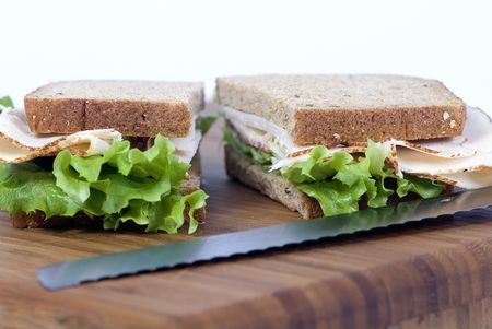 A fresh deli sandwich with lots of meat and green lettuceの写真素材