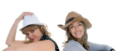 Two friends posing with different hats and looks.の写真素材