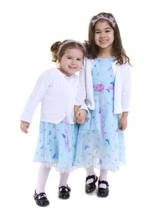 Two young girls all dressed up. Sistersの写真素材