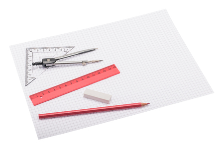 Drawing instruments lying on squared paper with space for textの写真素材