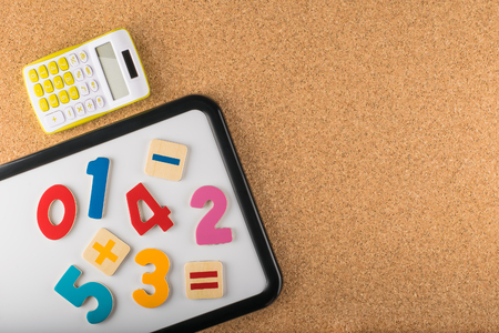 Magnetic board with numbers and calculator. Education concept