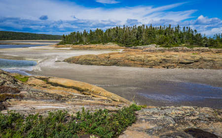 Rocky shoreline on the St Lawrence river near Raguneau in Cote Nord of Quebec, Canadaの写真素材