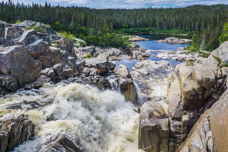 Chute Au Tonnerre waterfall, a 35 meters high waterfall near Riviere Au Tonnerre village, in Cote Nord region of Quebec, Canadaの写真素材