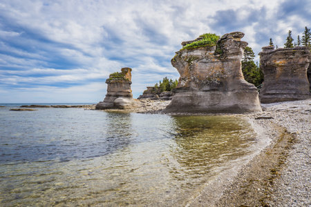 view on the limestone monoliths and rock formations on Niapiskau island in Mingan Archipelago National Park in Cote Nord region of Quebec, Canadaの写真素材