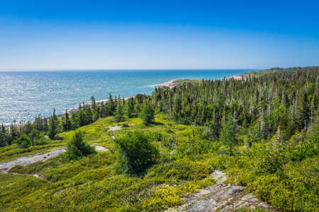 View on the St Lawrence river estuary and the shoreline from Magpie, in Cote Nord region of Quebec, Canadaの写真素材