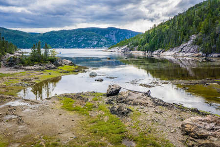 View on Anse Ã  la Barque at low tide, a cove of the Saguenay fjord located near Tadoussac, in Cote Nord region of Quebec, Canadaの写真素材