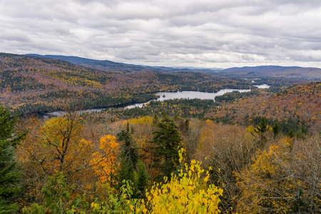 View on the Assomption lake and the Laurentides mountains from the Belvedere at the end of "Grandes Vallees" hiking trail in Mont Tremblant National Park, in Quebec, Canadaの写真素材