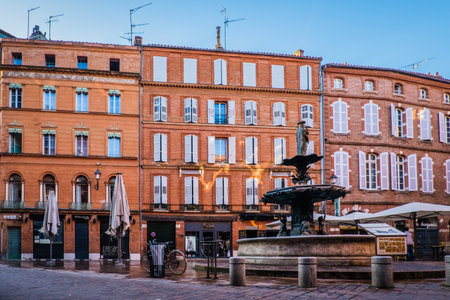 Fountain, brick buidings and shops on Roger Salengro square in the center of the city of Toulouse, in the south of France (Haute Garonne)のeditorial素材