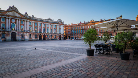 Chairs, tables and sunshade of a cafÃ© terrace on the Capitole square in Toulouse in the south of France (Haute Garonne)のeditorial素材