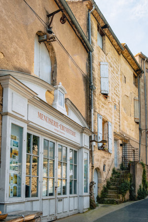 Beautiful french traditional wooden storefront in Montmorency street in the old medieval town of Pezenas in the south of France (Herault)のeditorial素材