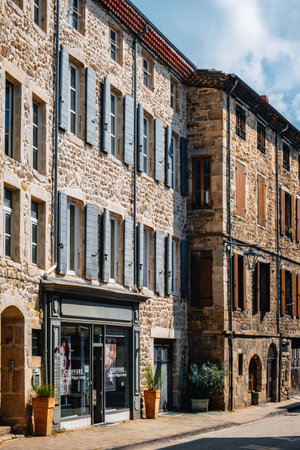Quaint stone facades and haidresser wooden storefront in the medieval village of Boulieu Les Annonay in the south of France (Ardeche)のeditorial素材