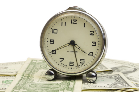 clock and money on isolated white background