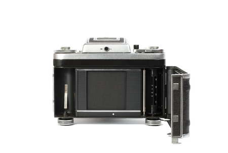 silvery-black mechanical 35mm photo camera isolated on white の写真素材