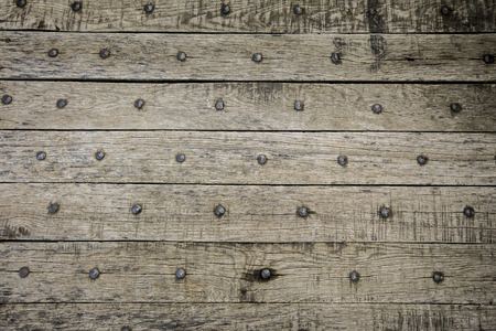 old rustic wooden background with rusty nailsの写真素材