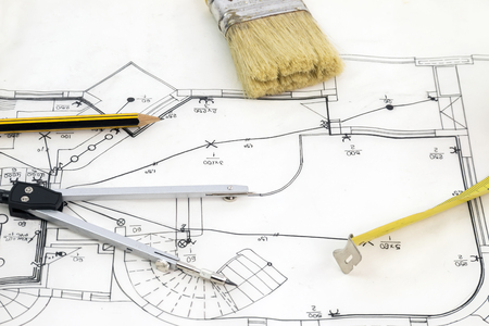 New house sketch drawing with pencil compasses and tape measureの写真素材