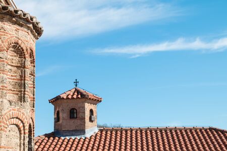 A Little tower on the roof of the old church. Blue sky with copy spaceの写真素材