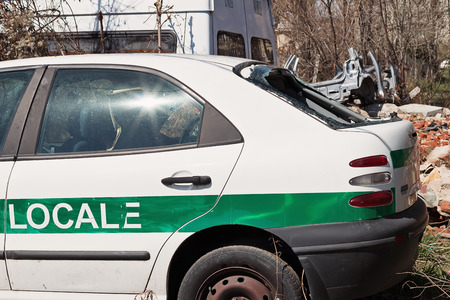 Crashed italian police white rusty old carの写真素材