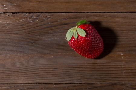 fresh red strawberry  close up on wooden backgroundの写真素材