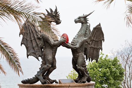 Powerful Bronze Dragons sculpture with Red Eggの写真素材